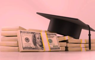 Mortar Board on a stack of money